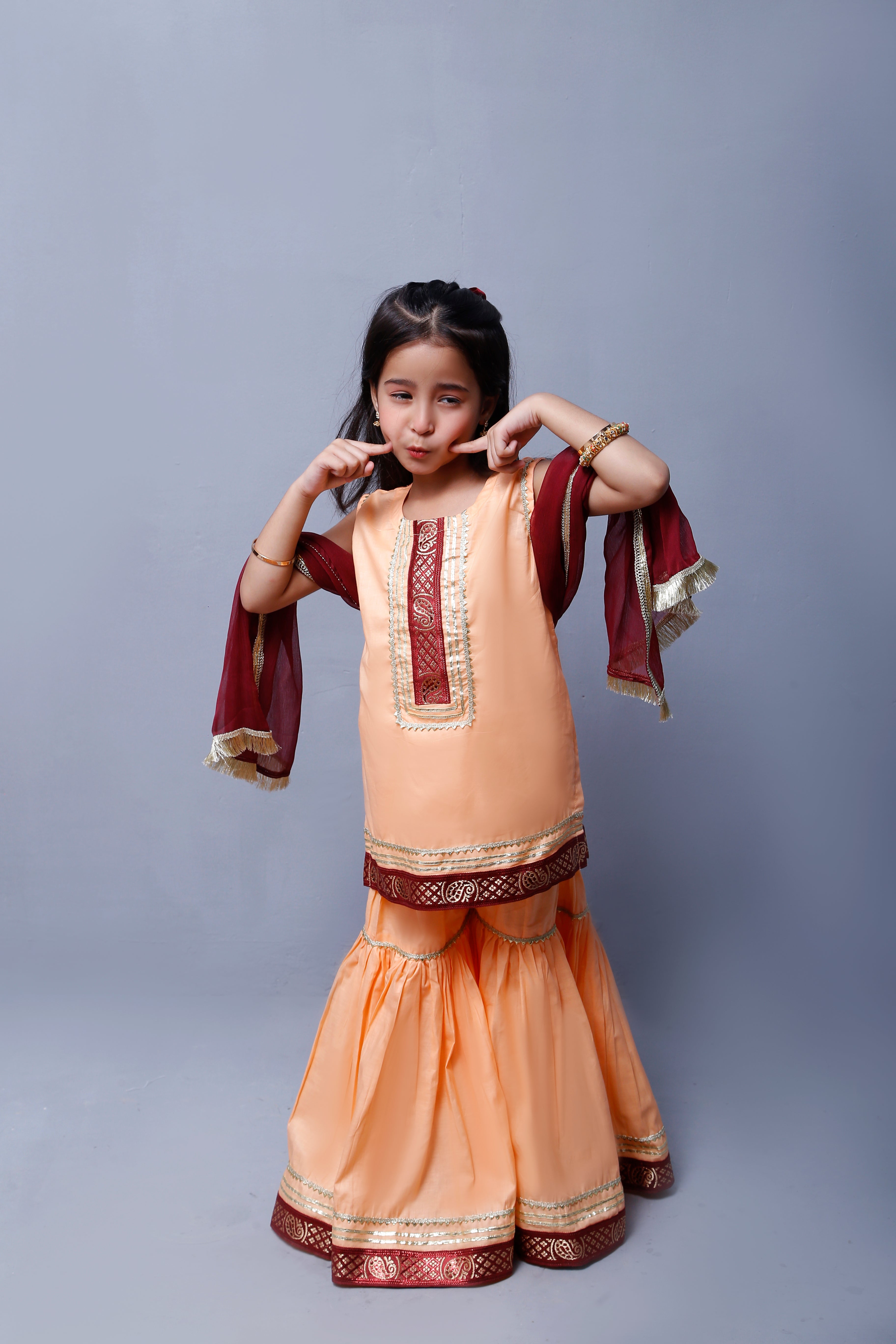 3 piece Elegant Peach Cotton Sleeveless Gharara Suit with Maroon & Golden Laces with Maroon Chiffon Dupatta.(Stitch)