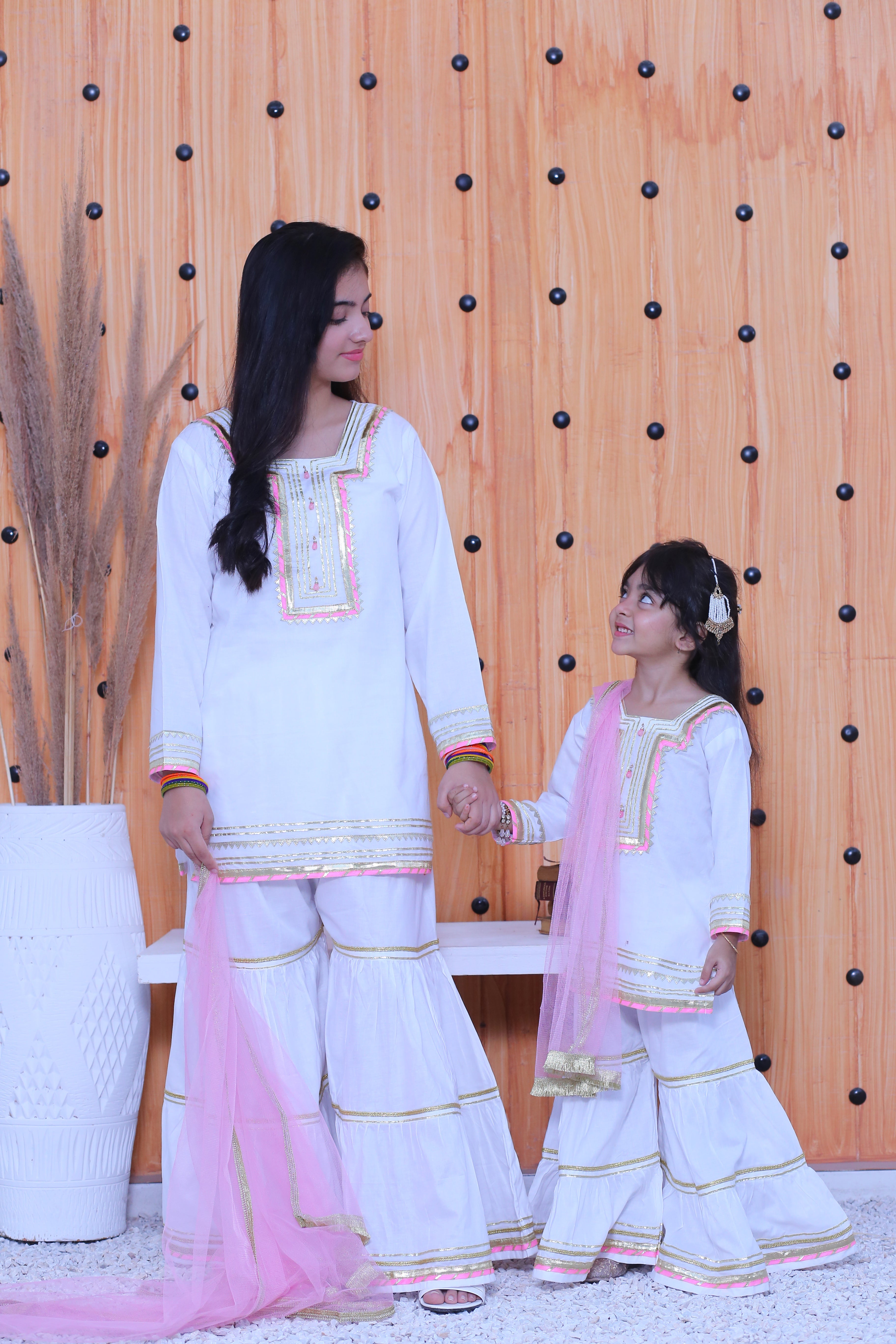 3 piece White Cotton Gharara Suit wiith Baby Pink net Dupatta & Baby Pink & Golden Laces.(Stitch)