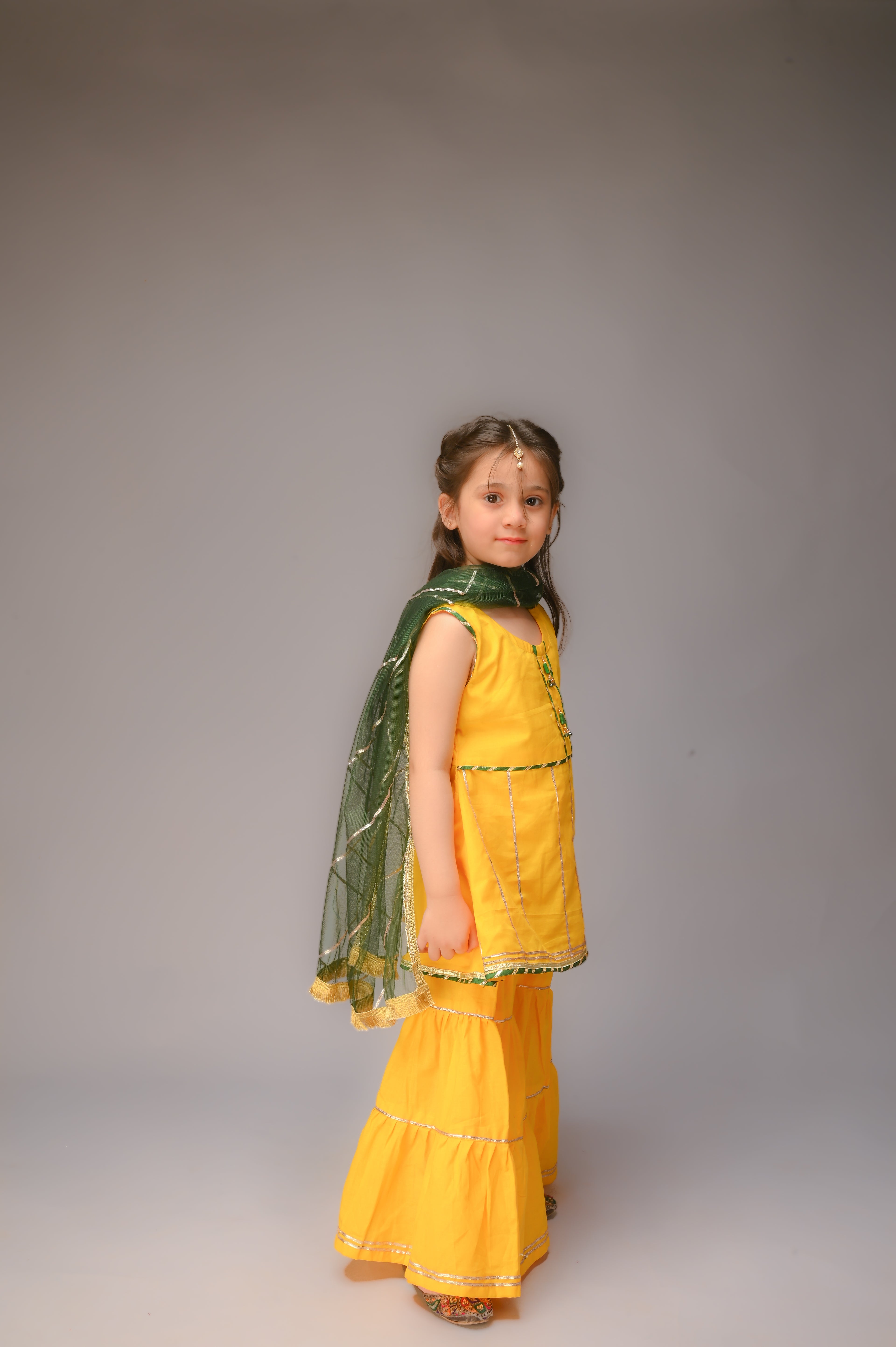 3 piece Yellow Cotton Sleeveless Gharara Suit with Bottle Green net Dupatta & Bottle Green & Golden Laces.(Stitch)